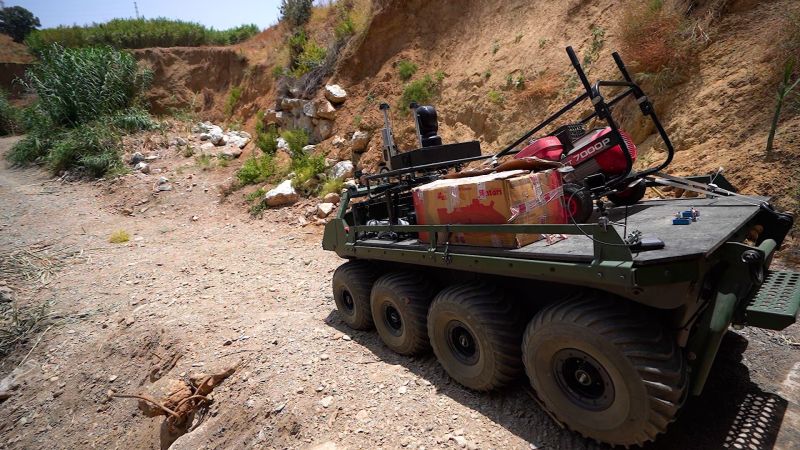 The UGV delivering batteries, seen from a drone